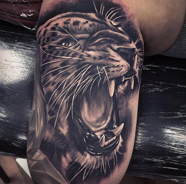 angry-jaguar-tattoo-on-half-sleeve-by-fred-flores
